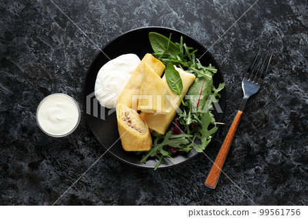Concept of tasty food, thin pancakes with filling, top view 99561756