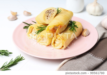 Concept of tasty food, thin pancakes with filling 99561780