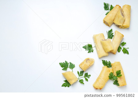 Concept of tasty food, thin pancakes with filling, space for text Concept of tasty food, thin pancakes with filling, space for text 99561802