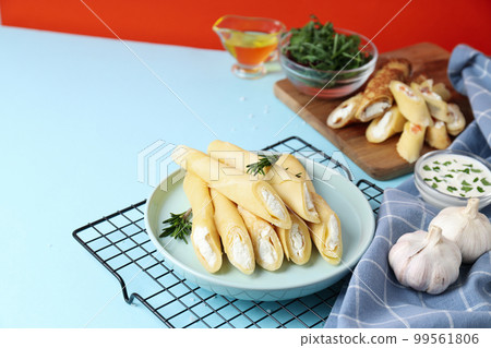Concept of tasty food, thin pancakes with filling, space for text Concept of tasty food, thin pancakes with filling, space for text 99561806