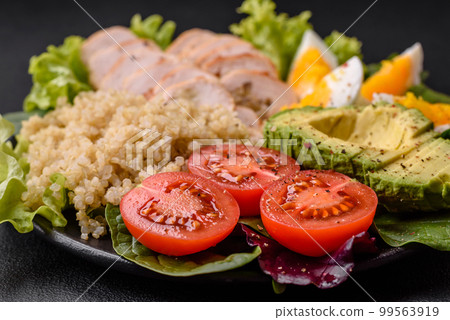 Delicious healthy lunch consisting of chicken, avocado, quinoa, eggs and tomatoes 99563919