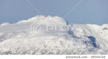 Snow and Cloud covered Canadian Nature Landscape Background. Whistler Snow and Cloud covered Canadian Nature Landscape Background. Whistler 99564188