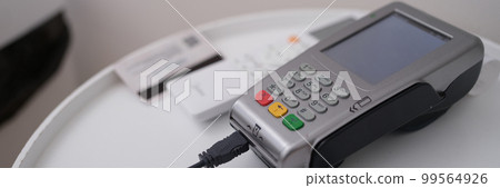 Credit card and payment terminal card reader closeup 99564926