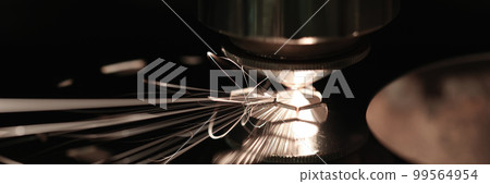 Sparks while cutting metal on black closeup Sparks while cutting metal on black closeup 99564954