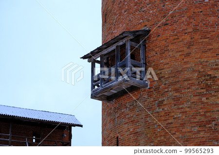 The wooden balcony of the main tower of Turaida walled castle at one of the oldest castles in Latvia. Vidzeme region of Latvia, on the opposite bank of the Gauja river from Sigulda. Gauja National The wooden balcony of the main tower of Turaida walled castle at one of the oldest castles in Latvia. Vidzeme region of Latvia, on the opposite bank of the Gauja river from Sigulda. Gauja National 99565293
