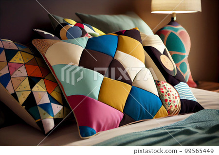 Interior of a living room with a sofa covered with patchwork pillows Interior of a living room with a sofa covered with patchwork pillows 99565449