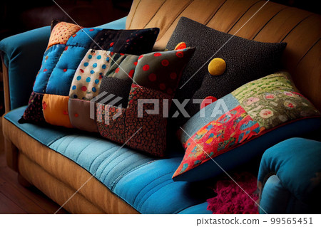 Interior of a living room with a sofa covered with patchwork pillows Interior of a living room with a sofa covered with patchwork pillows 99565451