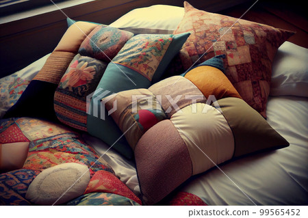 Interior of a living room with a sofa covered with patchwork pillows 99565452