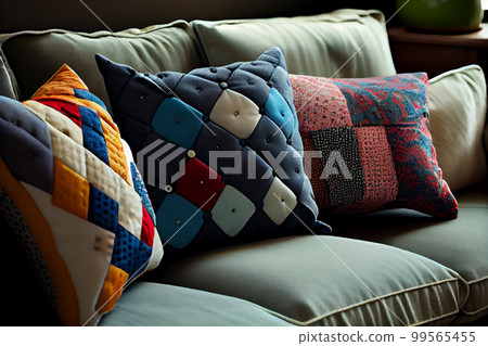 Interior of a living room with a sofa covered with patchwork pillows Interior of a living room with a sofa covered with patchwork pillows 99565455