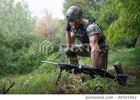 A soldier in the grass pray God 99565462