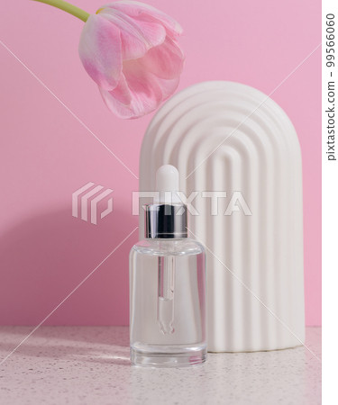 Clear glass dropper bottle with cosmetic product Clear glass dropper bottle with cosmetic product 99566060