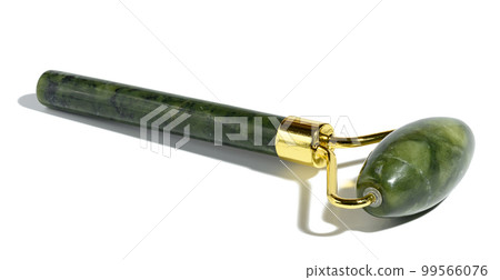A green jade stone facial and body massager on a white isolated background A green jade stone facial and body massager on a white isolated background 99566076