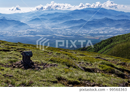 The Yatsugatake mountain range, the stone shrine at the summit of Mt. Iodake and the mountains of Okuchichibu The Yatsugatake mountain range, the stone shrine at the summit of Mt. Iodake and the mountains of Okuchichibu 99568363