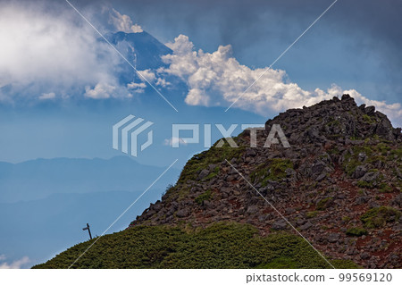 Three peaks and Mt. Fuji seen from Yatsugatake mountain range, Yokodake 99569120