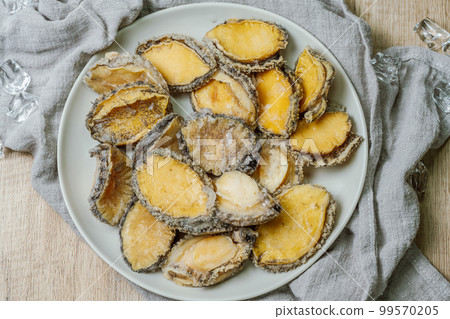 Seafood ingredients raw abalone on a plate 99570205
