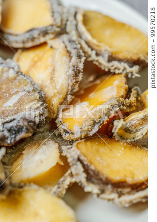 Seafood ingredients raw abalone on a plate Seafood ingredients raw abalone on a plate 99570218