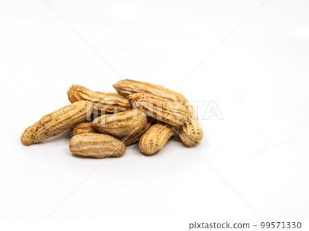 Close up stream peanuts, smalll heap of peanuts with shell, side view, selected focus, image on white background. Close up stream peanuts, smalll heap of peanuts with shell, side view, selected focus, image on white background. 99571330