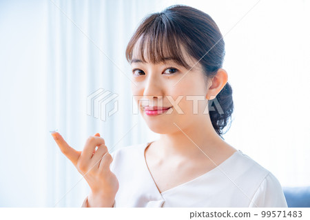 Women trying to wear contact lenses Women trying to wear contact lenses 99571483