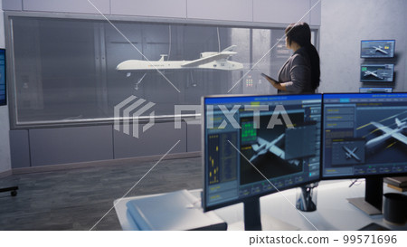 Engineers check aerodynamics of drone Engineers check aerodynamics of drone 99571696