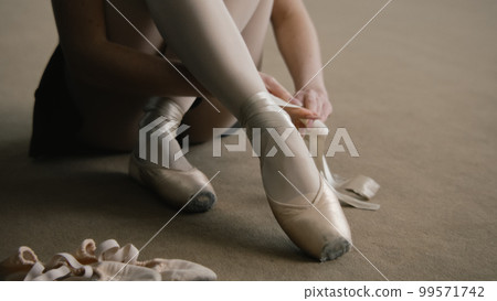 Ballerina dresses pointe shoes at dance studio 99571742