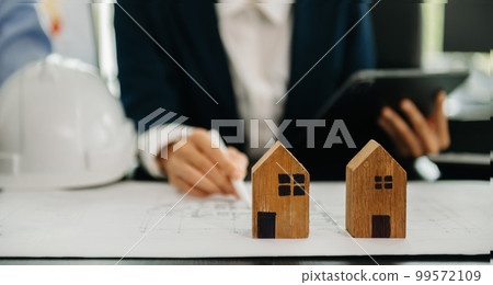 Considering buying a home, investing in real estate. Broker signs a sales agreement. agent, lease agreement, successful deal . Considering buying a home, investing in real estate. Broker signs a sales agreement. agent, lease agreement, successful deal . 99572109