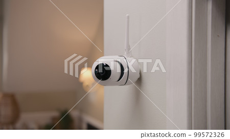 CCTV camera on wall in modern apartment CCTV camera on wall in modern apartment 99572326