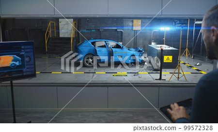 Male engineer simulates traffic accident 99572328