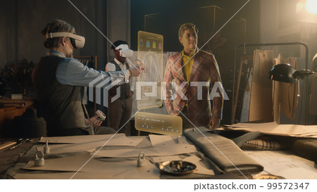 Tailor and male customer in VR headsets 99572347