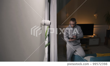 Man turns on night vision on CCTV camera 99572398