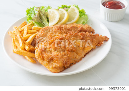 Homemade Breaded Weiner Schnitzel with Potato Chips 99572901