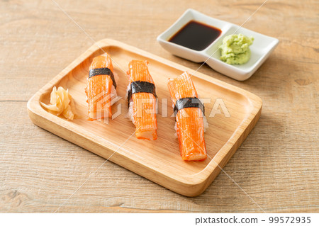 Crab Stick Sushi on wood plate 99572935