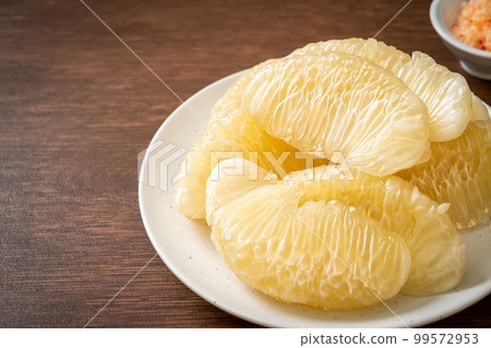 Fresh peeled pomelo, grapefruit or shaddock Fresh peeled pomelo, grapefruit or shaddock 99572953