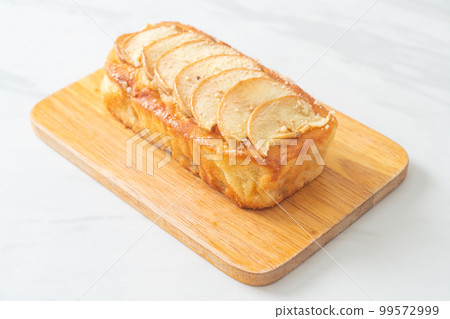 apple loaf crumbled on wood board apple loaf crumbled on wood board 99572999