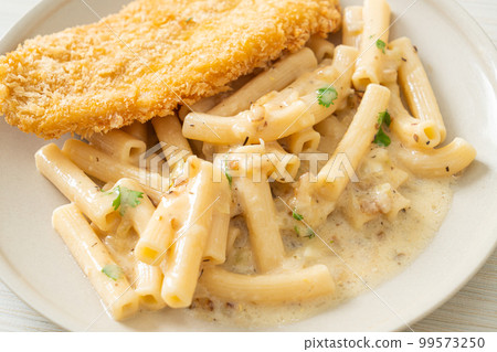 quadrotto penne pasta white cream sauce with fried fish 99573250