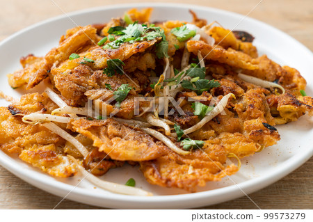 Crispy fried mussel pancake with egg Crispy fried mussel pancake with egg 99573279