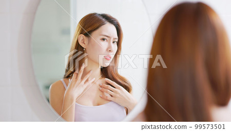 Woman worry about neck skin 99573501