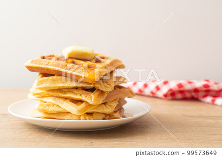 waffle stack with butter and honey 99573649