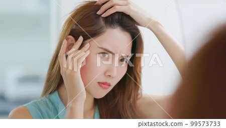 woman worry her hair woman worry her hair 99573733