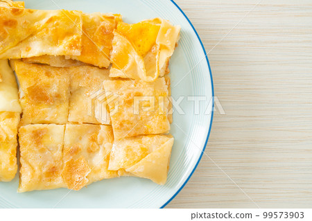 roti with egg and sweetened condensed milk roti with egg and sweetened condensed milk 99573903