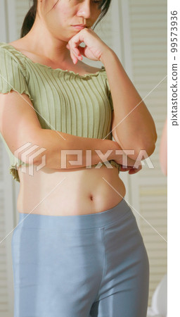 woman dissatisfied about body shape 99573936
