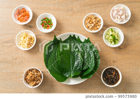 Miang kham - A royal leaf wrap appetizer 99573980