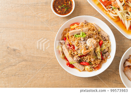 Instant noodles spicy salad on plate Instant noodles spicy salad on plate 99573983