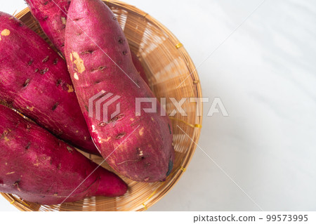 Japanese sweet potatoes on basket Japanese sweet potatoes on basket 99573995