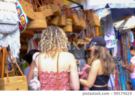 Ubud market in Bali bustling with tourists (February 2023) 99574829