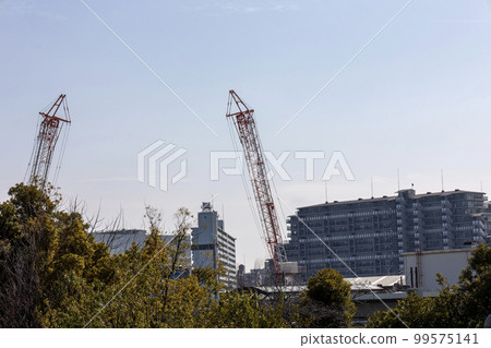 Crane at building construction site Crane at building construction site 99575141