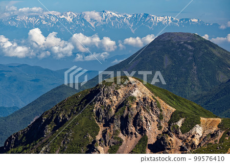 Mt. Tengu, Mt. Tateshina, and the remaining snow of the Shirouma mountain range seen from the Yatsugatake mountain range and Mt. Iodake Mt. Tengu, Mt. Tateshina, and the remaining snow of the Shirouma mountain range seen from the Yatsugatake mountain range and Mt. Iodake 99576410