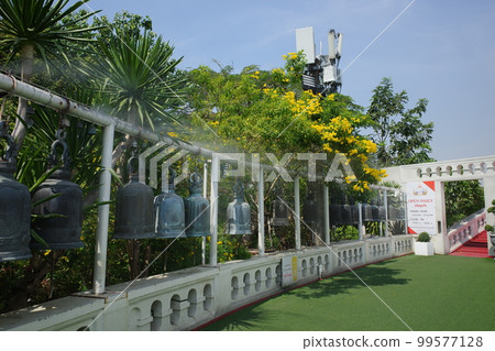 Row of bells at Wat Saket in Thailand 99577128