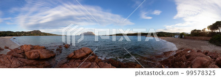 Rocky and Sandy Beach in Porto Istana, Sardinia, Italy. Tavolara Island in Background. 99578325