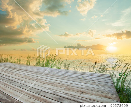 Pier, sea and beautiful sunset 99578409