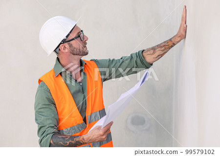 portrait builder professional engineer architect foreman hipster worker work in construction site, checking drywall finished job portrait builder professional engineer architect foreman hipster worker work in construction site, checking drywall finished job 99579102